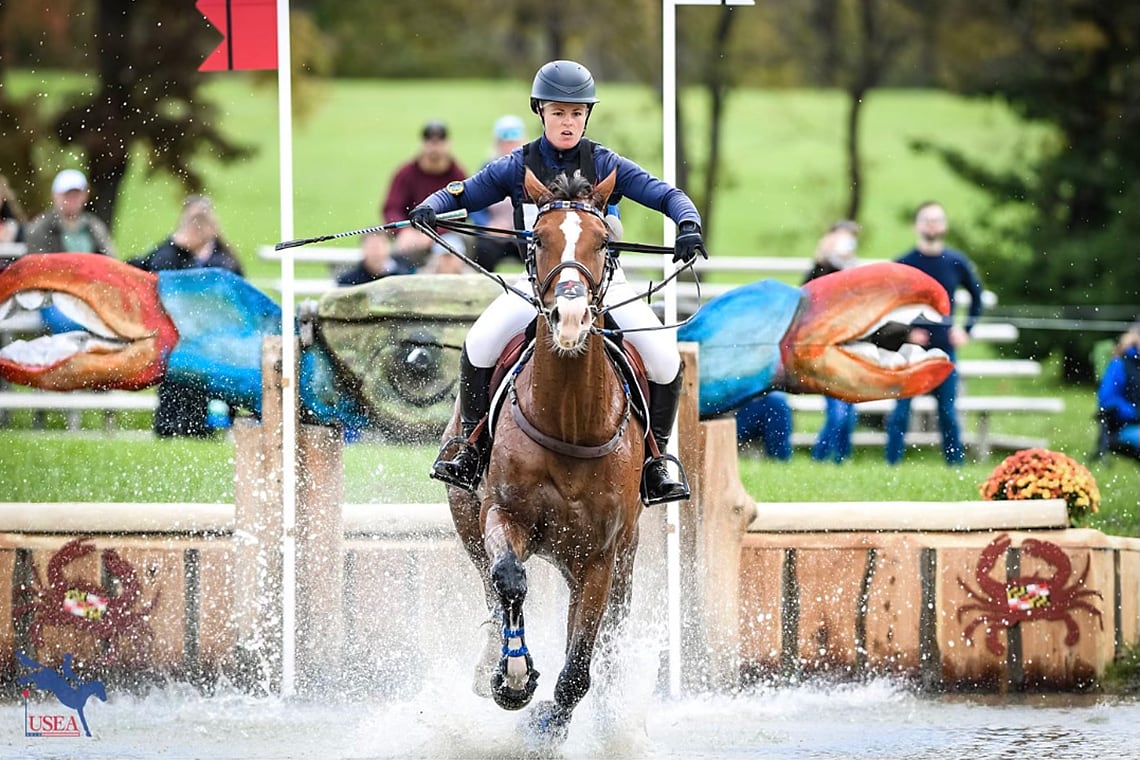 Autumn Schweiss doing a jump with her horse during the Cross Country phase